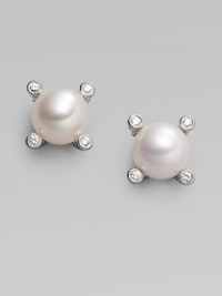 From the Cable Pearl Wrap Collection. Four sparkling diamonds emerge from a cabled setting of sterling silver, surrounding a lustrous pearl. 6mm white cultured freshwater pearl Diamonds, 0.04 tcw Sterling silver Diamter, about ¼ Post back Imported From the Cable Pearl Wrap Collection. Four sparkling diamonds emerge from a cabled setting of sterling silver, surrounding a lustrous pearl. 6mm white cultured freshwater pearl Diamonds, 0.04 tcw Sterling silver Diamter, about ¼ Post back Imported