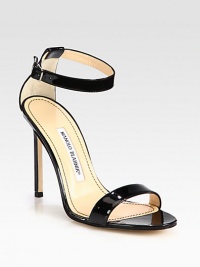 A minimalistic design in lustrous patent leather, heightened by a slender heel. Self-covered heel, 4 (100mm)Patent leather upperLeather lining and solePadded insoleMade in Italy A minimalistic design in lustrous patent leather, heightened by a slender heel. Self-covered heel, 4 (100mm)Patent leather upperLeather lining and solePadded insoleMade in Italy
