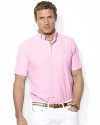 The embodiment of preppy heritage, a classic-fitting shirt is rendered in light-as-air seersucker cotton with sleek stripes for a casual warm-weather look.