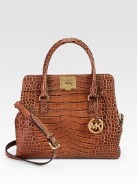 A roomy carryall in luxurious crocodile embossed leather with radiant hardware.Double top handles, 4½ dropDetachable adjustable shoulder strap, 17-19½ dropFlip-lock closureProtective metal feetOne outside zip pocketOne inside zip pocketFour inside open pocketsCotton lining13¼W X 11H X 5½DImported A roomy carryall in luxurious crocodile embossed leather with radiant hardware.Double top handles, 4½ dropDetachable adjustable shoulder strap, 17-19½ dropFlip-lock closureProtective metal feetOne outside zip pocketOne inside zip pocketFour inside open pocketsCotton lining13¼W X 11H X 5½DImported