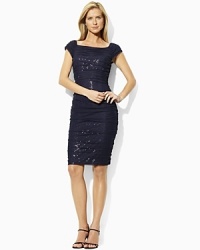 Finished with a boat neckline and shirring down the sides for a flattering, body-contouring fit, a bold sequined dress with a mesh overlay exudes chic, sexy appeal. Finished with a boat neckline and shirring down the sides for a flattering, body-contouring fit, a bold sequined dress with a mesh overlay exudes chic, sexy appeal.