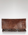 The power clutch is the bag to want now, and this Elie Tahari style works the trend in leather-trimmed calf hair with a streamlined silhouette.