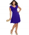 Look sensational and slim with Soprano's sleeveless plus size dress, featuring a flattering faux wrap design.