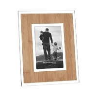 A faux bamboo insert provides the perfect backdrop, with silver accents for a natural yet eye-catching frame. A faux bamboo insert provides the perfect backdrop, with silver accents for a natural yet eye-catching frame.