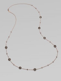 This 18k gold and sterling silver design is plated in 18k rose gold with faceted smokey quartz stations for a simply luxurious look. 18k gold and sterling silver with 18k rose goldplatingSmokey quartzLength, about 37Lobster clasp closureImported 