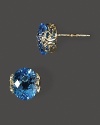 Faceted blue topaz in intricate 14K yellow gold settings.