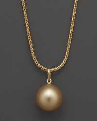 A timeless classic, this Tara Pearls necklace combines 18K yellow gold with a golden South Sea pearl. A timeless classic, this Tara Pearls necklace combines 18K yellow gold with a golden South Sea pearl.