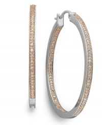 Give sparkle a whole, new hue! Traditional hoop earrings receive a modern update with the addition of dazzling, round-cut champagne diamonds (1/2 ct. t.w.). Set in sterling silver. Approximate diameter: 1-1/2 inches. Give sparkle a whole, new hue! Traditional hoop earrings receive a modern update with the addition of dazzling, round-cut champagne diamonds (1/2 ct. t.w.). Set in sterling silver. Approximate diameter: 1-1/2 inches.