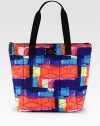 Tote your essentials using this roomy tote made of quilted nylon in bright, contrasting hues. Double top handles, 8½ dropZip closureOne inside open pocketCotton lining13W X 12H X 5DImported