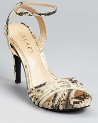 A strappy, snakeskin embossed silhouette from Lauren Ralph Lauren lends itself to daytime and after-hours alike. A strappy, snakeskin embossed silhouette from Lauren Ralph Lauren lends itself to daytime and after-hours alike.