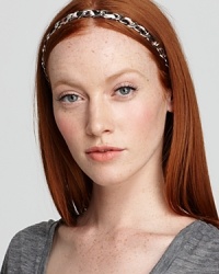 Finish your head-to-toe look with this stylish Juicy Couture headband that mixes the exotics trend with glints of metal. Finish your head-to-toe look with this stylish Juicy Couture headband that mixes the exotics trend with glints of metal.
