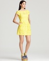 Light up the room in a sunflower yellow Nanette Lepore dress featuring ladylike eyelet and feminine embroidery. Perfect for a party, the look gets punchy when you add colored pumps.