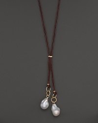 Boldly gleaming baroque freshwater pearls add rich luster to 14K yellow gold and leather. By Nancy B.