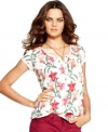 A simple tee is made girly with an artistic floral print and delicate henley placket, from Lucky Brand Jeans.