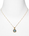 This haute bohemian pendant necklace from Coralia Leets charms with rich texture and hue. The gleaming gold setting sets off a luxe labradorite stone.