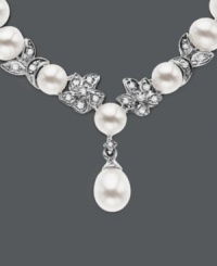 Cultured freshwater pearls (5.5-6mm) are paired with 14k white gold floral accents and shimmering diamond accents. Length measures 18 inches. Cultured freshwater pearls (5.5-6mm) are paired with 14k white gold floral accents and shimmering diamond accents. Length measures 18 inches.