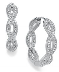Get in the mix. Eliot Danori's traditional hoop earrings take an unexpected twist with an intertwining design embellished with crystal accents. Set in rhodium-plated silver tone mixed metal. Approximate diameter: 1 inch. Get in the mix. Eliot Danori's traditional hoop earrings take an unexpected twist with an intertwining design embellished with crystal accents. Set in rhodium-plated silver tone mixed metal. Approximate diameter: 1 inch.