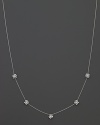 Five faceted diamond stations bloom on an 18K white gold necklace. By Roberto Coin.