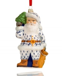 Filled with the charm of Christmas past, this Vaillancourt Santa Claus ornament is hand painted in a blue and white suit and trimmed in shimmering green and white glitter. Filled with the charm of Christmas past, this Vaillancourt Santa Claus ornament is hand painted in a blue and white suit and trimmed in shimmering green and white glitter.