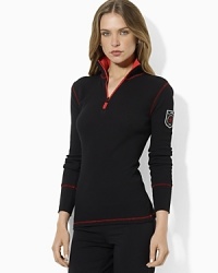 A soft waffle-knit top is steeped in athletic inspiration with a bold logo at the back and zippered mockneck. A soft waffle-knit top is steeped in athletic inspiration with a bold logo at the back and zippered mockneck.