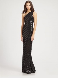Flattering bias stripes of shimmering sequins band this festive, floor-length design.Asymmetrical necklineSleevelessSequined embroideryConcealed side zipFully linedAbout 45 from natural waist95% polyester/5% spandexDry cleanMade in USA of imported fabricModel shown is 5'11 (180cm) wearing US size 4. Flattering bias stripes of shimmering sequins band this festive, floor-length design.Asymmetrical necklineSleevelessSequined embroideryConcealed side zipFully linedAbout 45 from natural waist95% polyester/5% spandexDry cleanMade in USA of imported fabricModel shown is 5'11 (180cm) wearing US size 4.