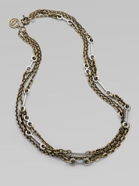 An industrial-inspired piece in a multi-chain design with a antique-finish. Antique-finished brass and sterling silverLength, about 30Spring ring closureImported 