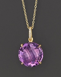 Pavé diamonds and an amethyst sparkle in an 18K yellow gold setting. Pavé diamonds and an amethyst sparkle in an 18K yellow gold setting.