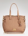 Don't by shy! This Juicy Couture quilted nylon satchel is spacious enough to hold it all, and then some.