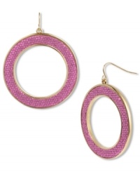 Girly sparkle is always a must. Betsey Johnson's fierce hoop earrings feature a dusting of fuchsia glitter for a flirty look. Set in gold tone mixed metal. Approximate drop: 2-1/2 inches. Approximate diameter: 2 inches.