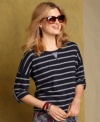 Be casual-chic in Tommy Hilfiger's cotton tee, featuring classic stripes and cool roll-tab sleeves.