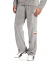 Take the lead and stay ahead of the pack with comfort and style in these velour Ferrari track pants from Puma.