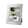 Vera Wang's Blanc Sur Blanc frame features a wide border of vivid silver plate that warmly complements treasured photographs.