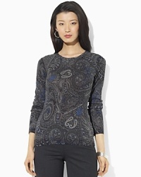 A lustrous silk-and-cashmere construction lends sultry appeal to a classic crewneck sweater. A lustrous silk-and-cashmere construction lends sultry appeal to a classic crewneck sweater.