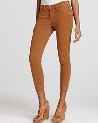 An ultra-cropped silhouette lends a retro feel to these 7 For All Mankind skinny jeans, rendered in an earthy hue. An ultra-cropped silhouette lends a retro feel to these 7 For All Mankind skinny jeans, rendered in an earthy hue.