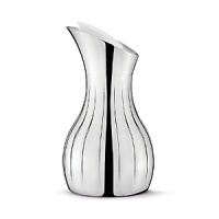 The Georg Jensen Legacy collection is a perfect illustration of how a more decorative style incorporated into modern design can result in a gorgeous piece - the smooth, curved surfaces are mirroring their surroundings in a world of glittering sumptuousness. The Georg Jensen Legacy pitcher is ideal for pouring water or juice, for example. The decorative grooves provide a firm grip while the pitcher insulating design ensures that ice water stays cold for a while. The Georg Jensen Legacy pitcher is made of stainless steel and comes with an elegant white stopper. The Georg Jensen Legacy collection is a perfect illustration of how a more decorative style incorporated into modern design can result in a gorgeous piece - the smooth, curved surfaces are mirroring their surroundings in a world of glittering sumptuousness. The Georg Jensen Legacy pitcher is ideal for pouring water or juice, for example. The decorative grooves provide a firm grip while the pitcher insulating design ensures that ice water stays cold for a while. The Georg Jensen Legacy pitcher is made of stainless steel and comes with an elegant white stopper.