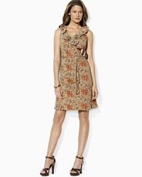 A chic sleeveless jersey dress is accented with feminine ruffles and slim ties at the waist for a flattering silhouette. A chic sleeveless jersey dress is accented with feminine ruffles and slim ties at the waist for a flattering silhouette.