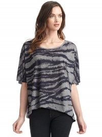 THE LOOKScoop necklinePullover styleShort dolman sleevesFront zebra print with solid contrast backAsymmetrical hemLeft vented hemTHE FITLoose fit silhouetteAbout 29 from shoulder to longest point of hemTHE MATERIALPolyesterCARE & ORIGINMachine washImported THE LOOKScoop necklinePullover styleShort dolman sleevesFront zebra print with solid contrast backAsymmetrical hemLeft vented hemTHE FITLoose fit silhouetteAbout 29 from shoulder to longest point of hemTHE MATERIALPolyesterCARE & ORIGINMachine washImported