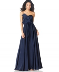 Make a glamorous style statement in this strapless evening gown from JS Collection. Make a glamorous style statement in this strapless evening gown from JS Collection.