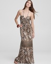 Go long and slither into this stunning maxi-length Sky dress--enriched with a chic snakeskin print and finished with a dramatic halter neckline, this dress takes wearable glamour to the hilt.