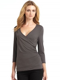 THE LOOKSurplice V-neckShirred detailingThree-quarter length sleevesTHE FITAbout 26 from shoulder to hemTHE MATERIAL92% viscose/8% spandexCARE & ORIGINMachine washMade in USA of imported fabricModel shown is 5'9½ (176cm) wearing US size Small. THE LOOKSurplice V-neckShirred detailingThree-quarter length sleevesTHE FITAbout 26 from shoulder to hemTHE MATERIAL92% viscose/8% spandexCARE & ORIGINMachine washMade in USA of imported fabricModel shown is 5'9½ (176cm) wearing US size Small.