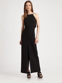 Incredibly elegant in a tailored, halter-neck sheath finished with a sexy high slit.Halter necklineSleevelessCropped overlaySet-in waistHigh back and front slitV-back with double button closureConcealed center back zipperAbout 37 from natural waist52% tencel/48% silkDry cleanMade in USA of Italian fabricModel shown is 5'9 (175cm) wearing US size Small. Incredibly elegant in a tailored, halter-neck sheath finished with a sexy high slit.Halter necklineSleevelessCropped overlaySet-in waistHigh back and front slitV-back with double button closureConcealed center back zipperAbout 37 from natural waist52% tencel/48% silkDry cleanMade in USA of Italian fabricModel shown is 5'9 (175cm) wearing US size Small.