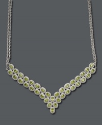 Perfect for an elegant affair. This luminous necklace features two glowing rows of oval-cut peridots (18 ct. t.w.) accented by sparkling diamonds. Setting crafted in sterling silver. Approximate chain length: 11 inches. Approximate total length: 18 inches. Perfect for an elegant affair. This luminous necklace features two glowing rows of oval-cut peridots (18 ct. t.w.) accented by sparkling diamonds. Setting crafted in sterling silver. Approximate chain length: 11 inches. Approximate total length: 18 inches.