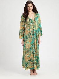 Experience the luxury of silky-smooth fabric featuring an artistic floral print. V-neckLong bell sleevesSelf-tie waistBack cinched waistbandAbout 53 from shoulder to hemPolyesterMachine washImported Experience the luxury of silky-smooth fabric featuring an artistic floral print. V-neckLong bell sleevesSelf-tie waistBack cinched waistbandAbout 53 from shoulder to hemPolyesterMachine washImported