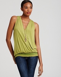 An embroidered smocked hem lends bohemian flair to this gorgeously draped Michael Stars tank. An embroidered smocked hem lends bohemian flair to this gorgeously draped Michael Stars tank.