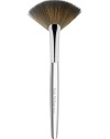 The latest addition to Trish's iconic collection of handcrafted makeup artistry brushes, the flat, arched shape and fine edge of Brush 62 Fan is precision-cut to deposit a whisper of color along the features, a veil of finishing powder to the under-eye, or as a tool to gently fan away fallout for a perfect finish. 