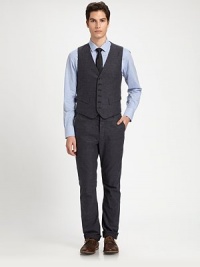 Add a finishing touch to a suit ensemble or a tailored structure to any casual look with this impeccably shaped, button-up vest, rendered in soft cotton for a handsomely modern feel.Button-frontWaist flap pocketsCottonDry cleanMade in USA Add a finishing touch to a suit ensemble or a tailored structure to any casual look with this impeccably shaped, button-up vest, rendered in soft cotton for a handsomely modern feel.Button-frontWaist flap pocketsCottonDry cleanMade in USA