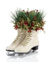 A fresh pair. Filled with holiday bouquets, these frosted white ice skates offer a whimsical expression of the season. A fresh pair. Filled with holiday bouquets, these frosted white ice skates offer a whimsical expression of the season.