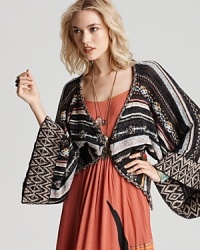This Free People cardigan layers on the luxe--a gorgeous addition to your all-season collection. With kimono sleeves and golden buttons, the striped cover-up conceals with chic. This Free People cardigan layers on the luxe--a gorgeous addition to your all-season collection. With kimono sleeves and golden buttons, the striped cover-up conceals with chic.