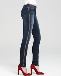 Supple lamb-leather side seams bring a hint of luxury to these otherwise laid-back J Brand skinny jeans. Supple lamb-leather side seams bring a hint of luxury to these otherwise laid-back J Brand skinny jeans.
