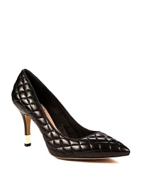 VINCE CAMUTO takes ultra-stylish pointed toe pumps to another fashion level with quilted leather and boldly gold heel accents. VINCE CAMUTO takes ultra-stylish pointed toe pumps to another fashion level with quilted leather and boldly gold heel accents.